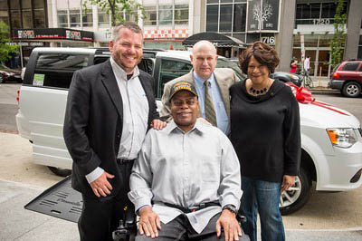 Charlie Johnson is shown with his wife and caregiver, Lola Johnson and other dignitaries.